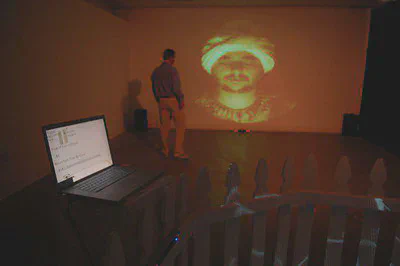 projection of fortune teller with person in front